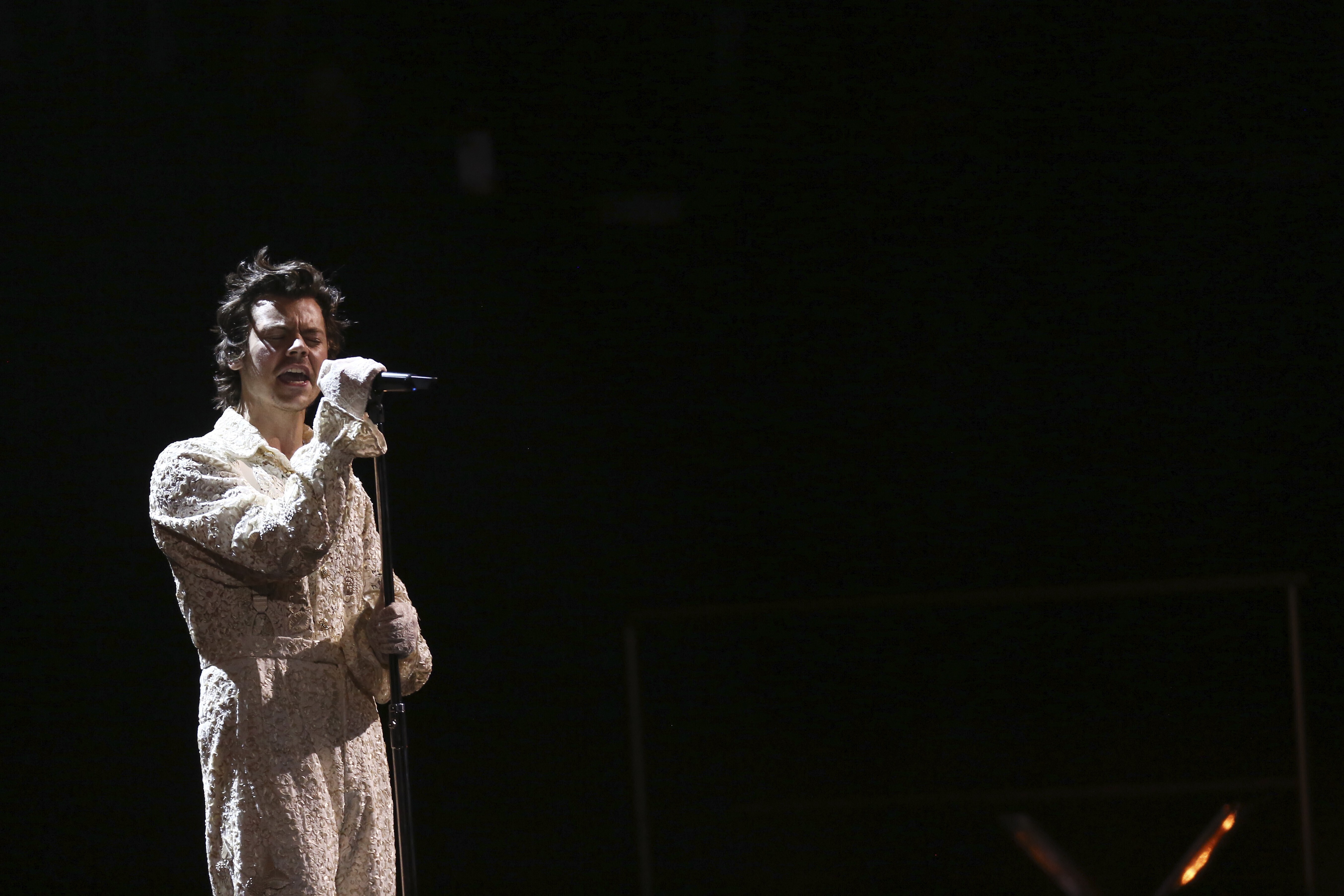 Harry Styles performs on stage at the Brit Awards 2020 in London, Tuesday, Feb. 18, 2020.